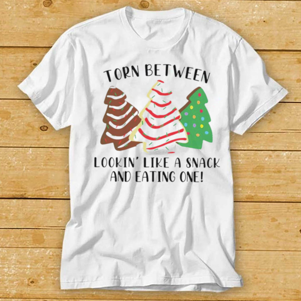 Torn between looking like a snack and cat in one Christmas shirt